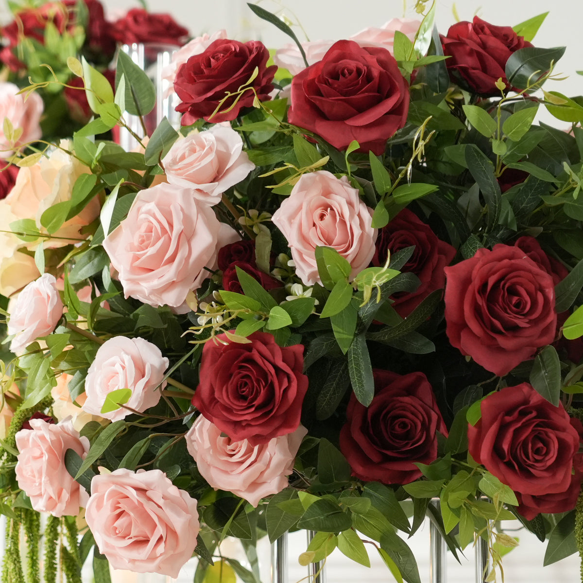outdoor sunset wedding tall table centerpiece burgundy roses