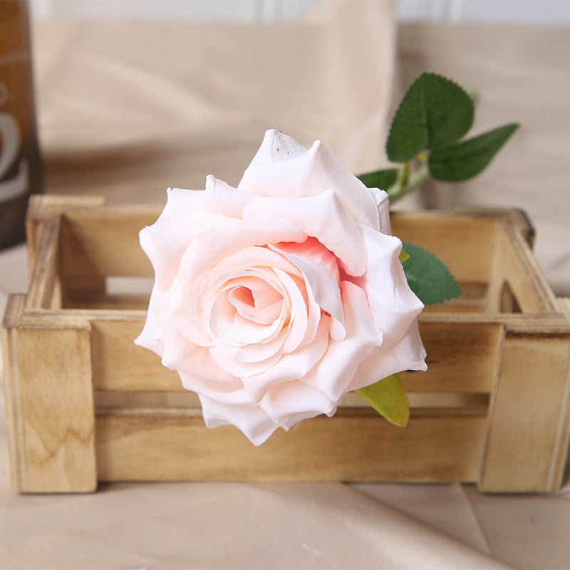 White artificial rose with foliage