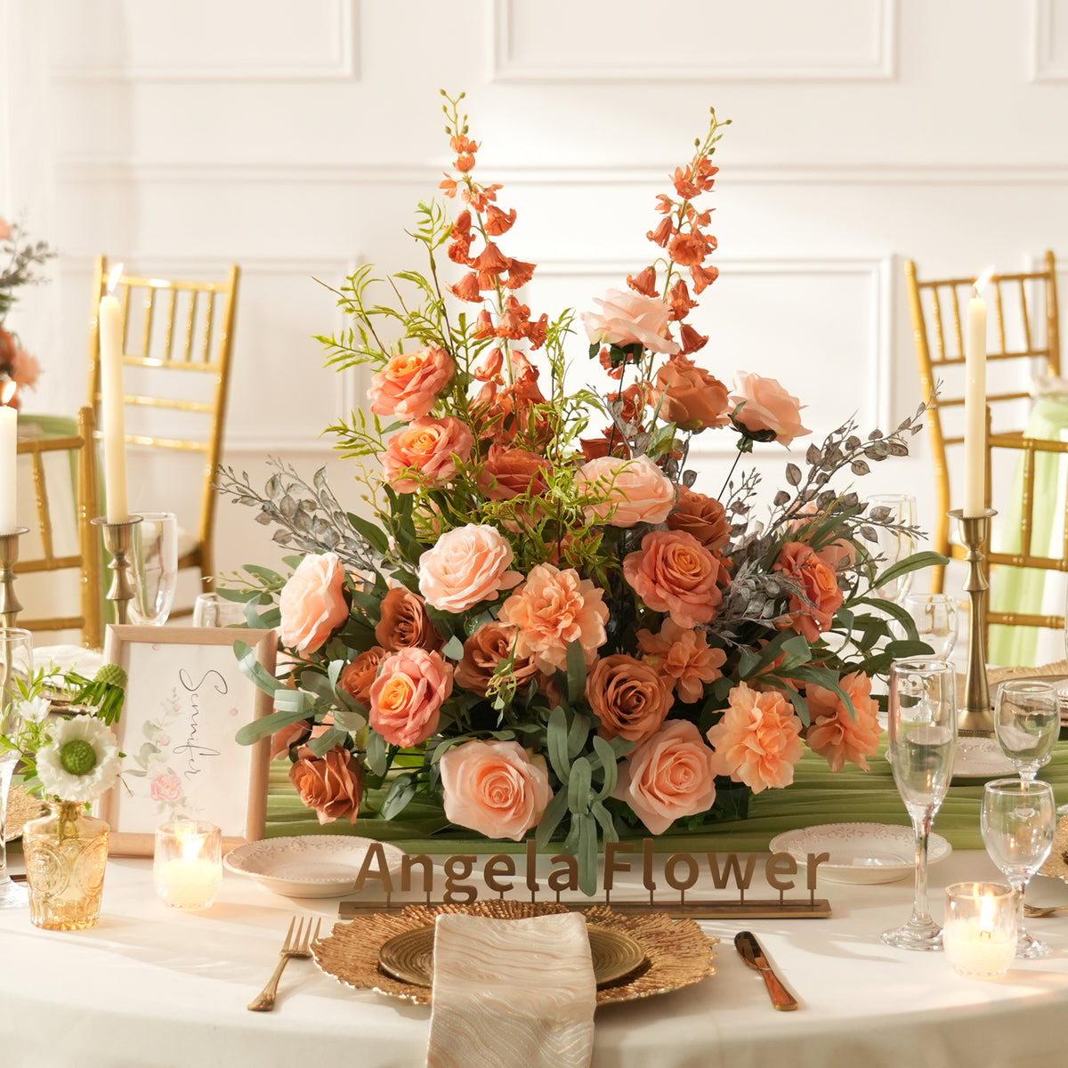Warm tone silk rose and textured greenery bouquet designed as wedding table centerpieces
