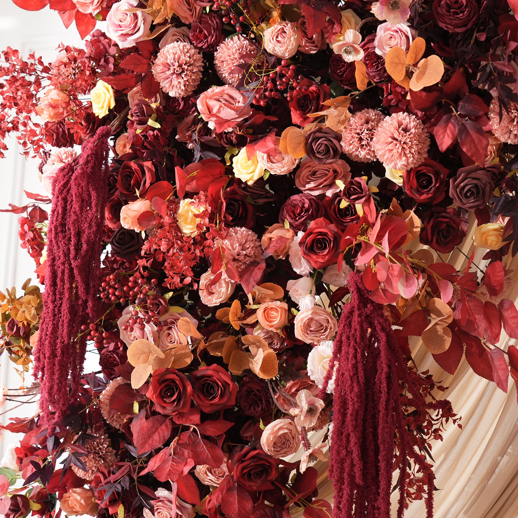 vintage burgundy wedding arch with drapery