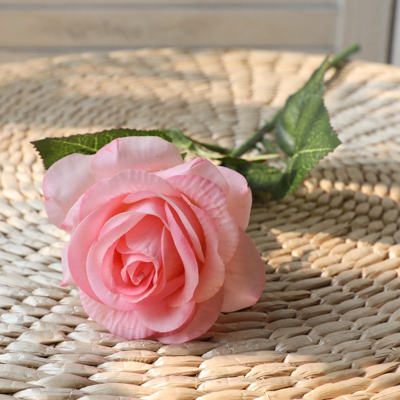 artificial-roses-on-window-table-decoration