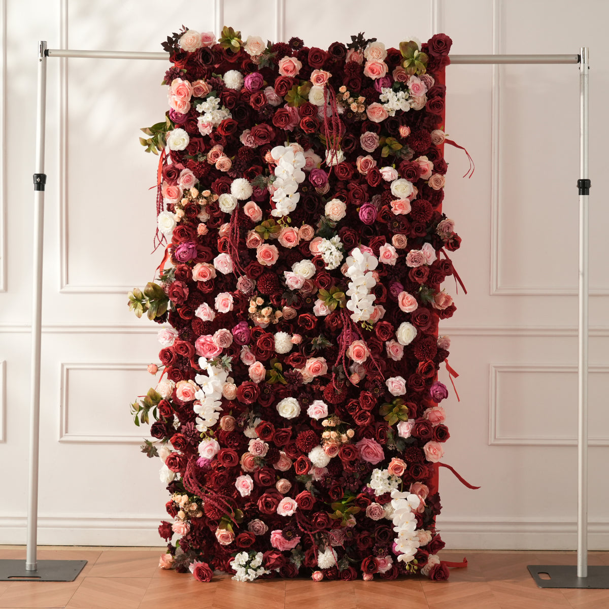 Burgundy flower wall with blush and white flower accents