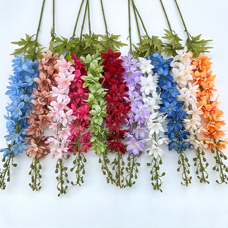 dusty‑orange‑artificial‑delphinium‑sprays‑wedding‑arrangement‑material