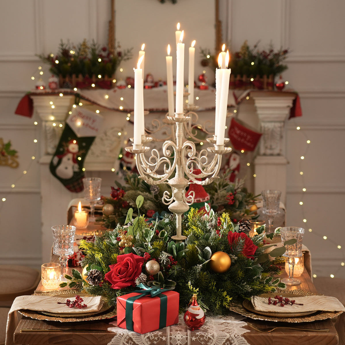 Cascading christmas corner swag with red roses, orange pods, pine sprigs and red berry clusters