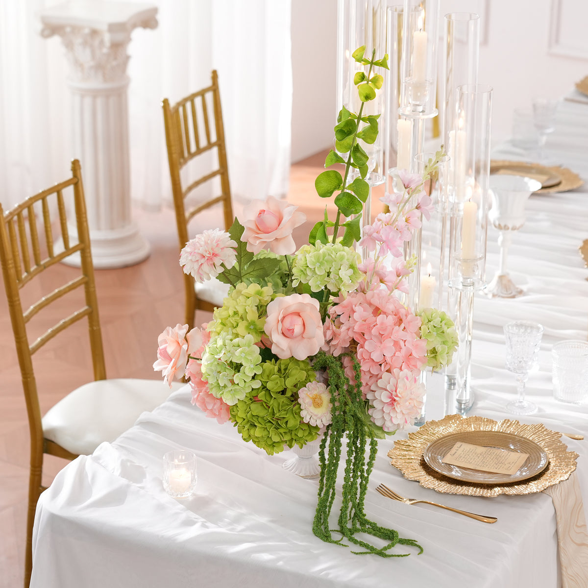 Indoor close‑up view of mixed silk flower vase table centerpiece display