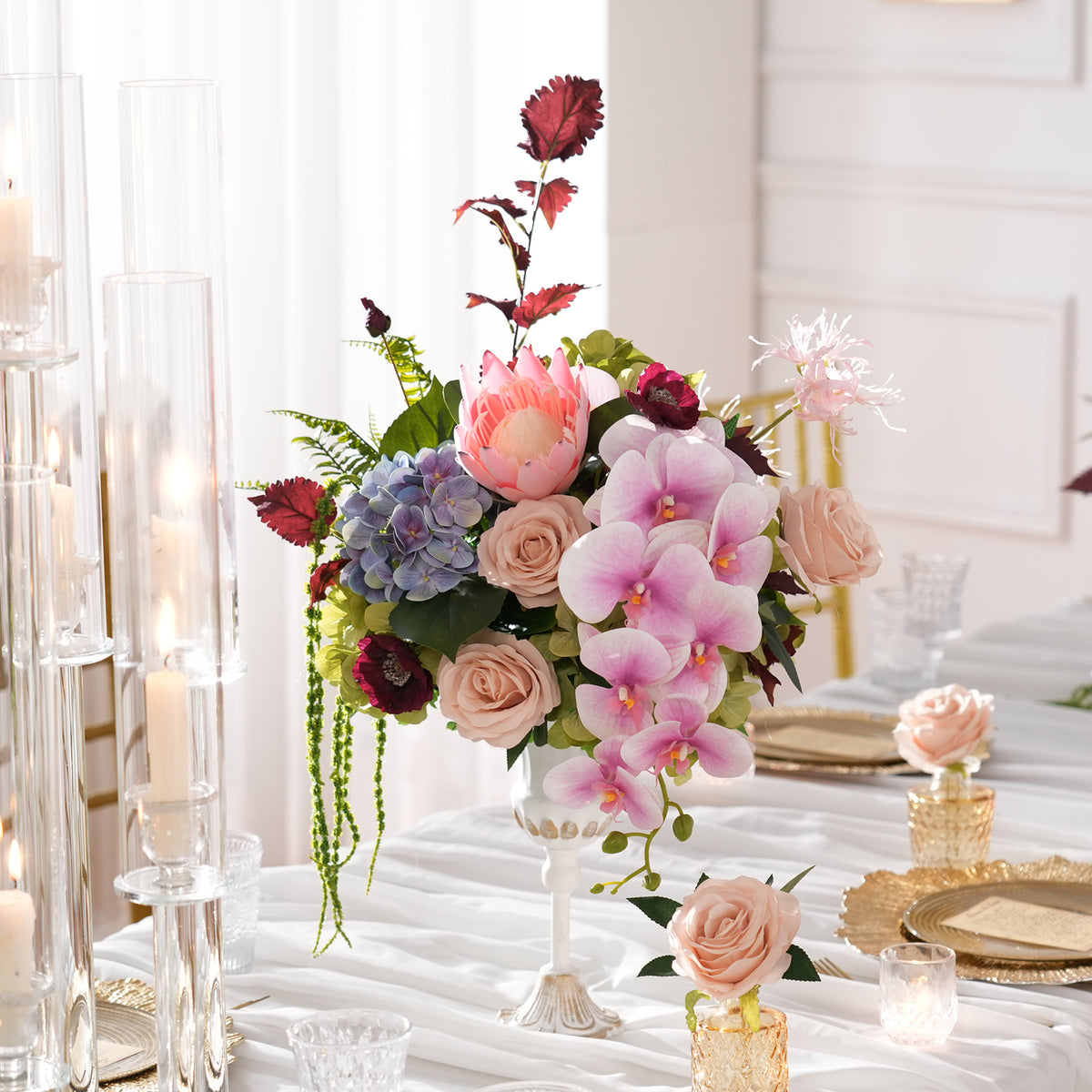 Garden‑style protea hydrangea table flower arrangement