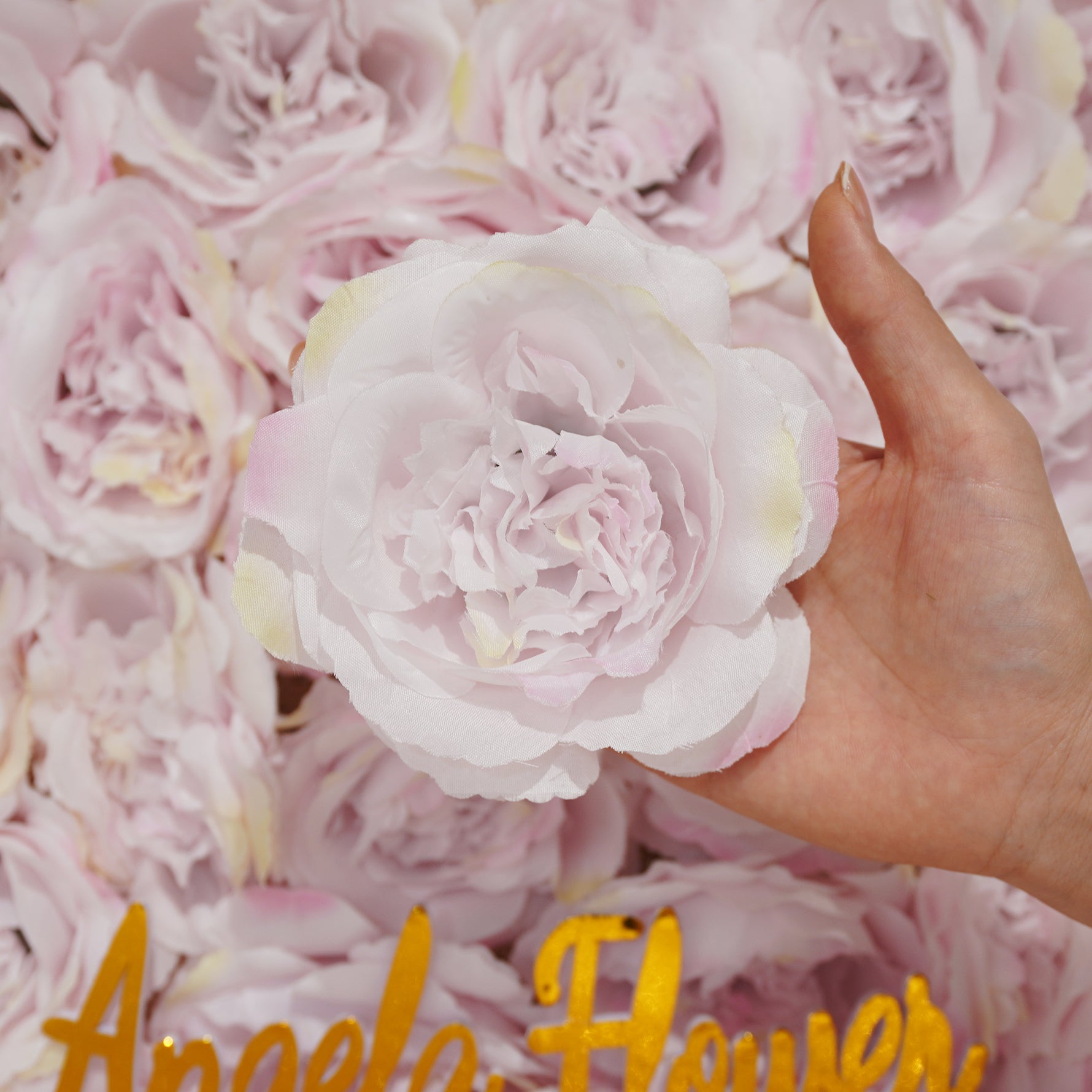 Silk rose head flat lay shot