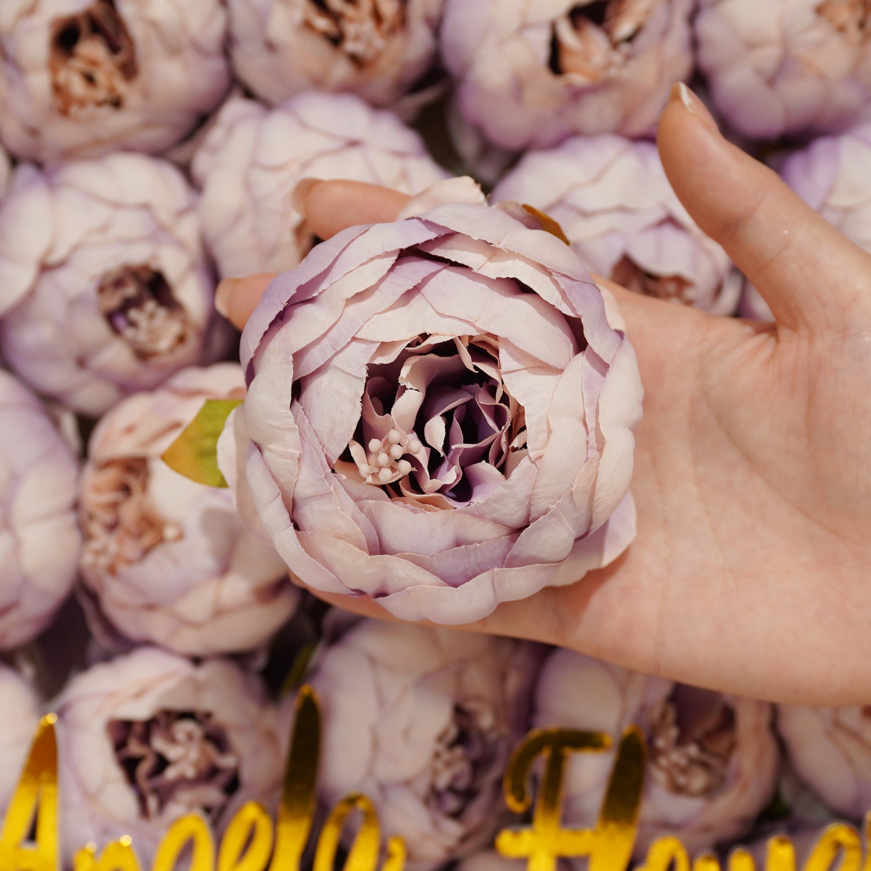 Coral peach faux ranunculus decor heads