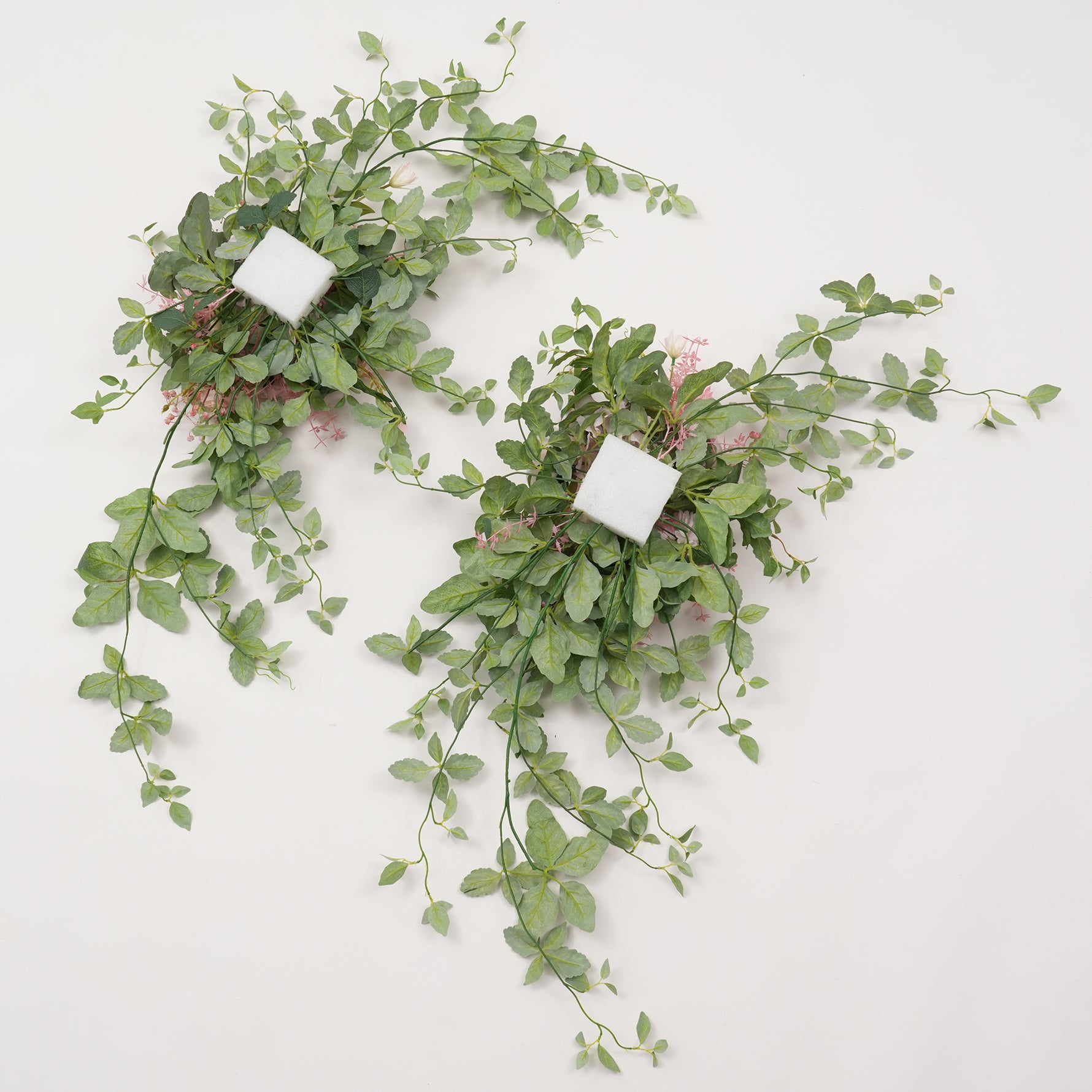 Light pink flower swag with green foliage