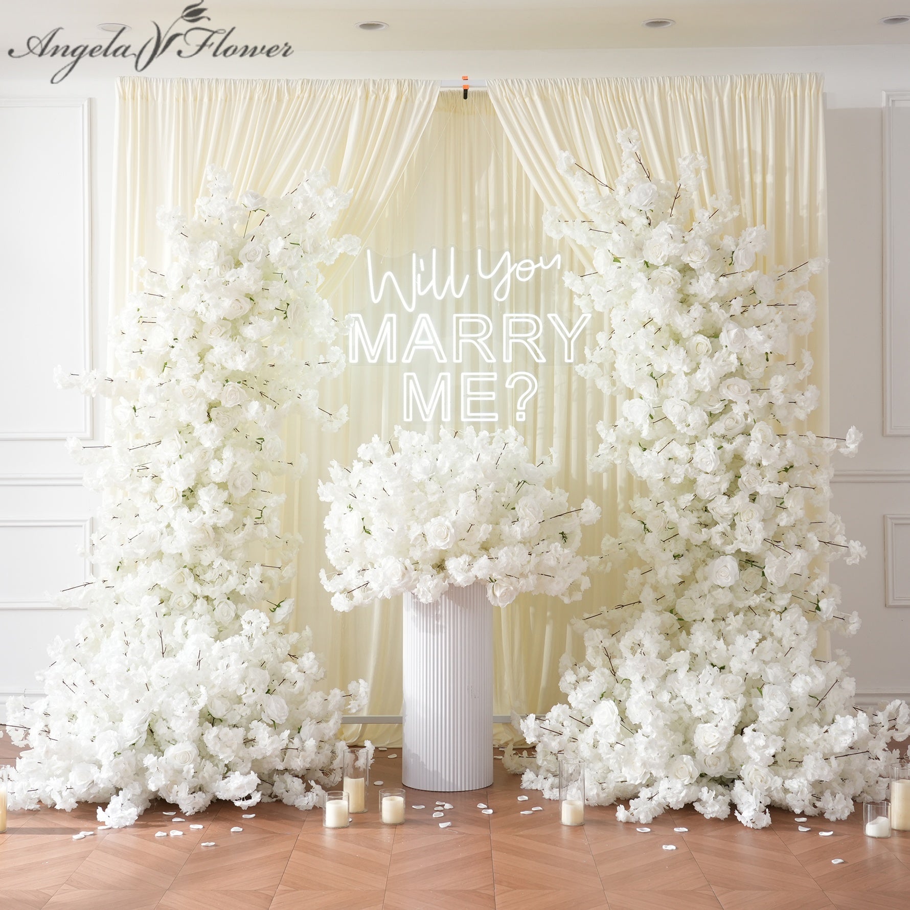 all white floral backdrop for marriage proposal