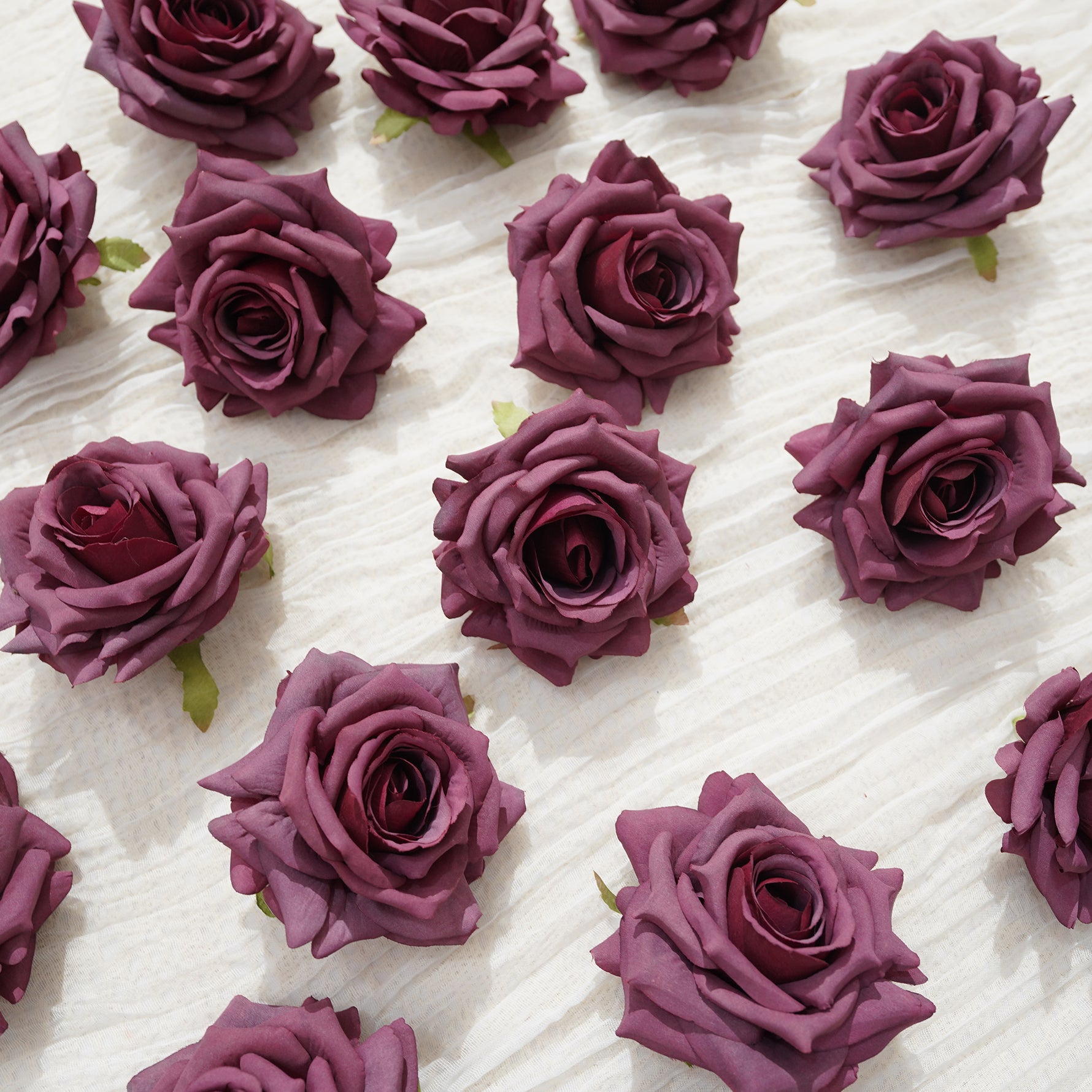 mixed‑mauve‑blush‑white‑fake‑rose‑heads‑arranged‑heart‑shape