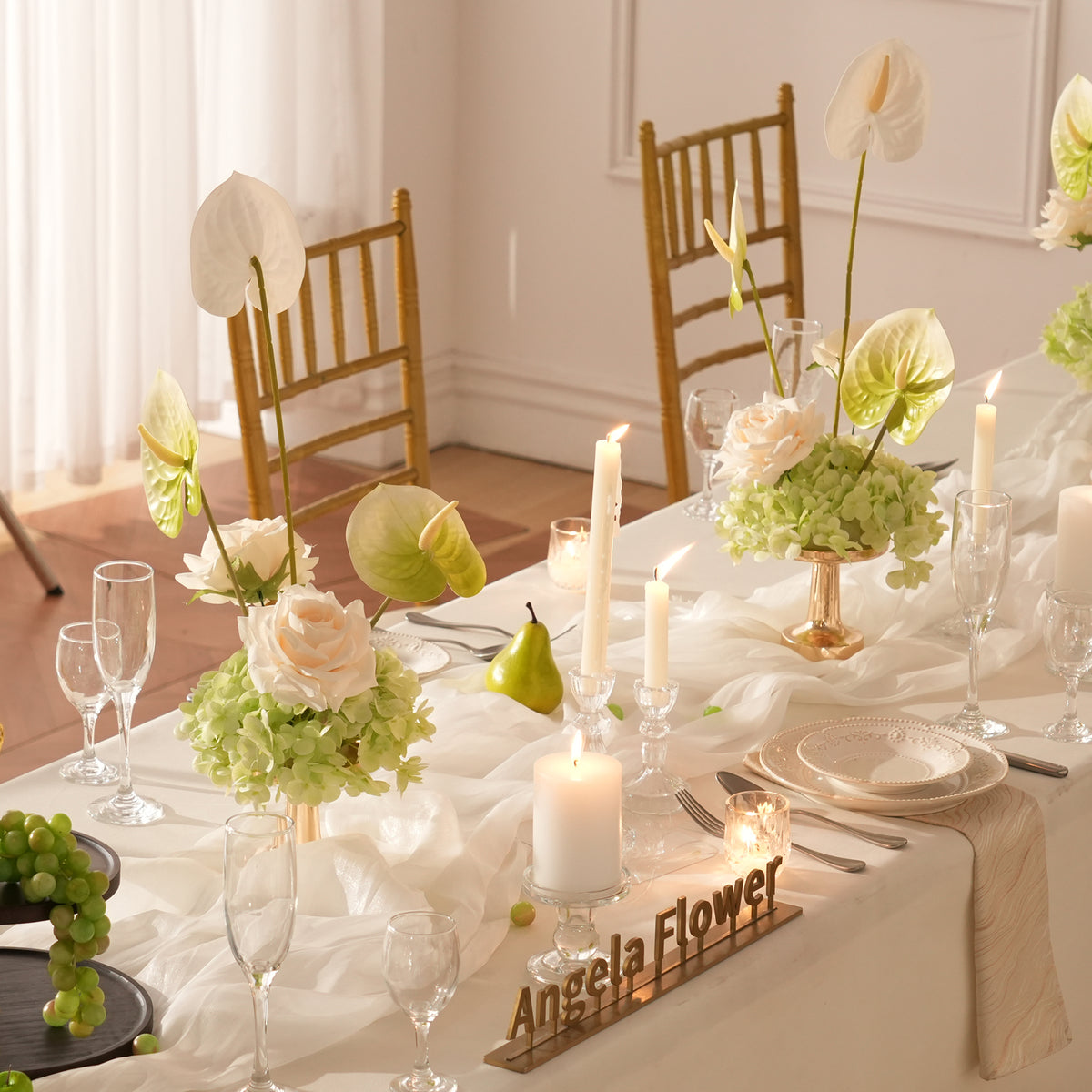 Outdoor wedding table with white linen and faux flower decor