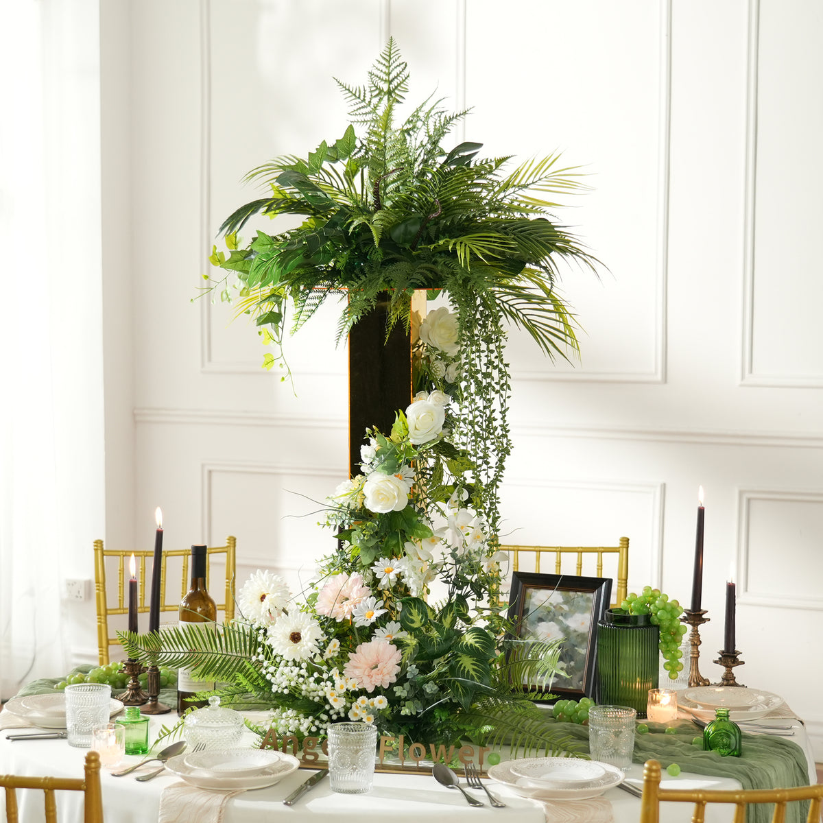 Tall gold stand flower arrangement for indoor reception