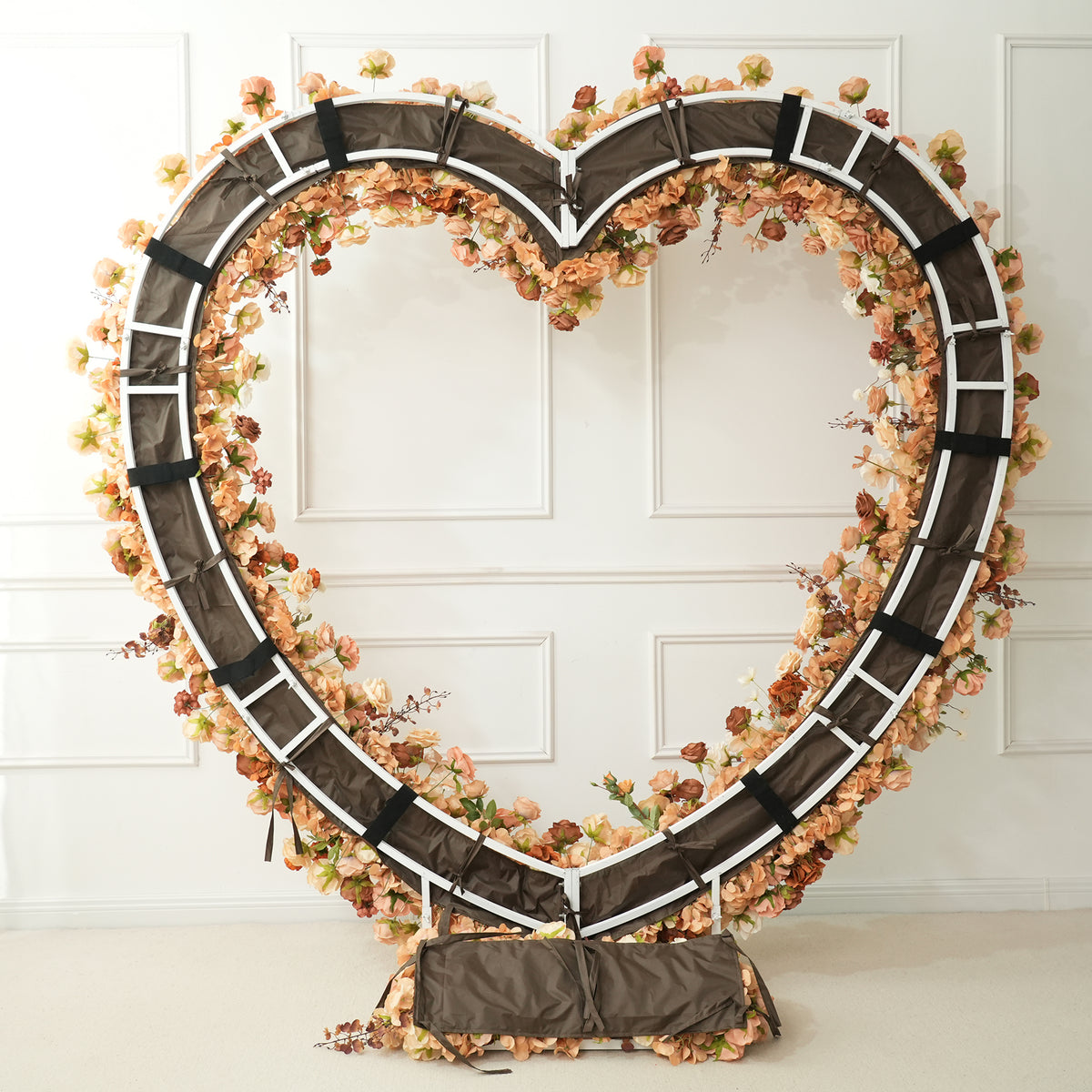 Taupe heart flower arch wedding ceremony decor