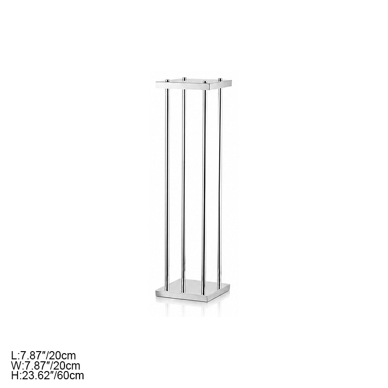 Silver metal pillar stands with soft window shadow on neutral beige wall