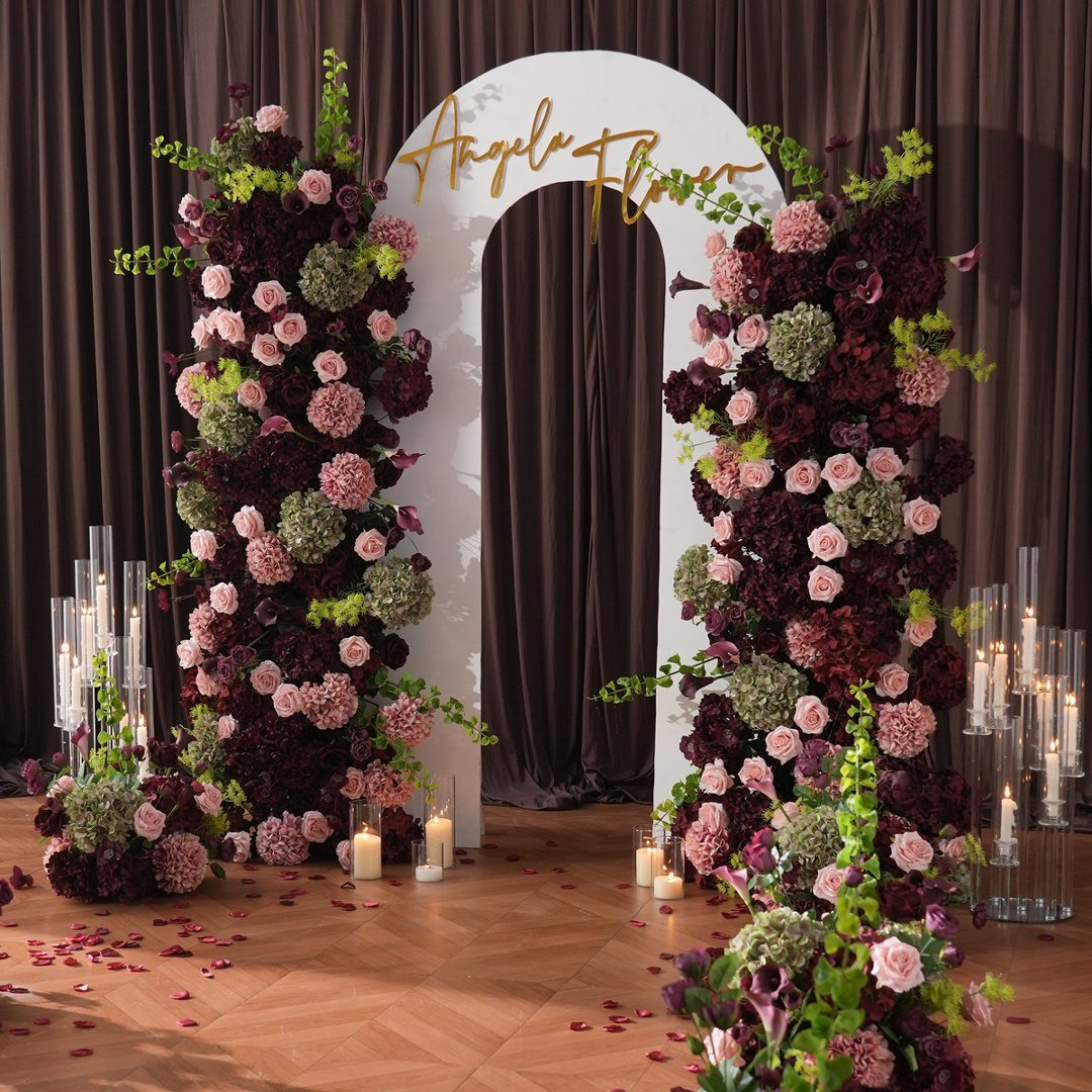 Indoor wedding ceremony setup with white KT arched backdrop