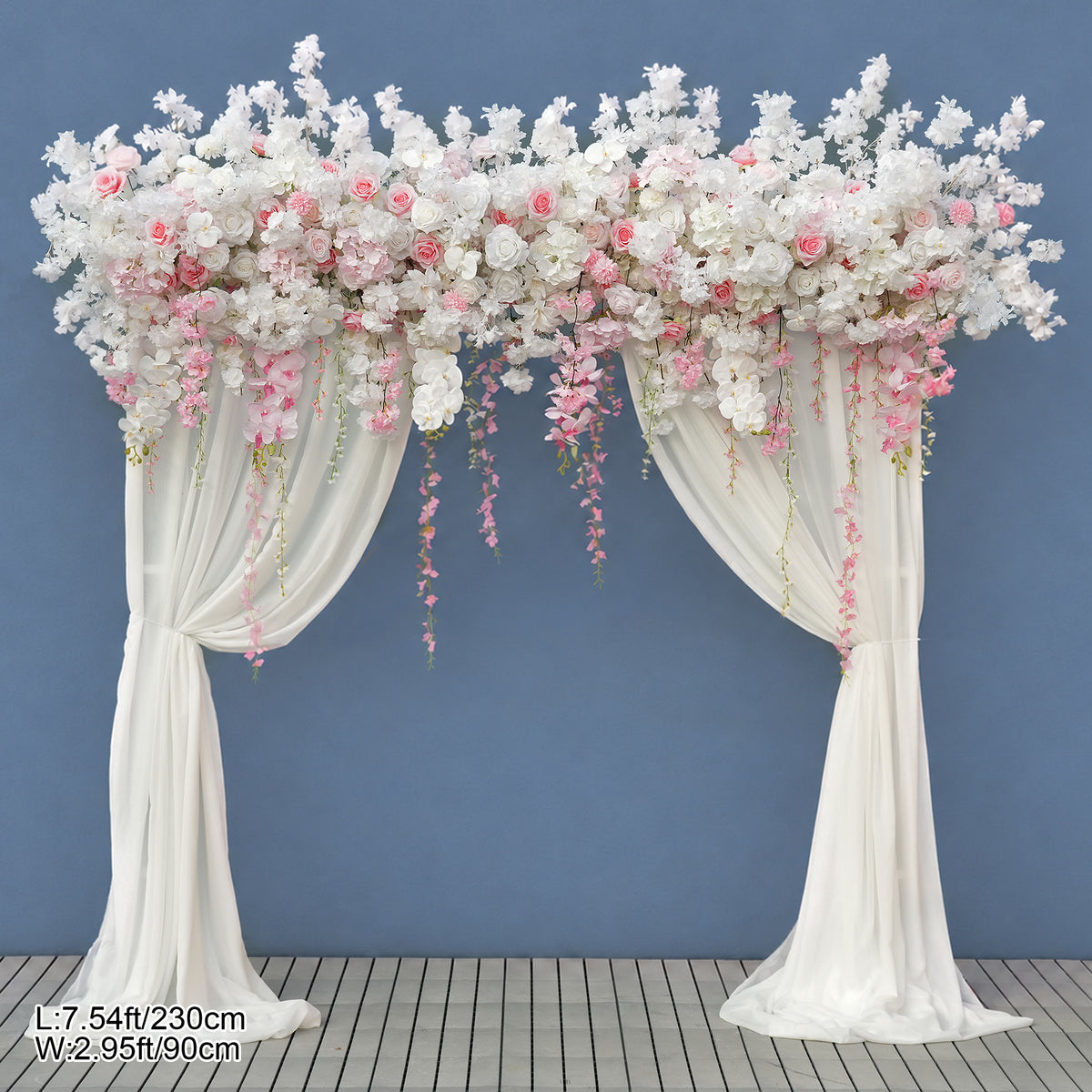 Light pink cherry blossom arch with hanging vines