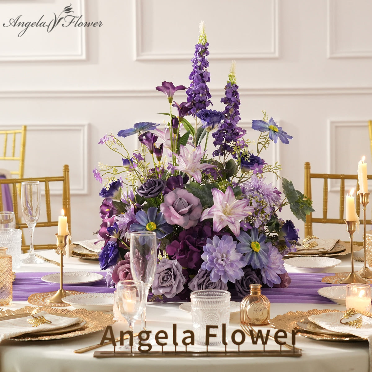 Deep violet mixed faux flower table centerpiece for wedding reception styling
