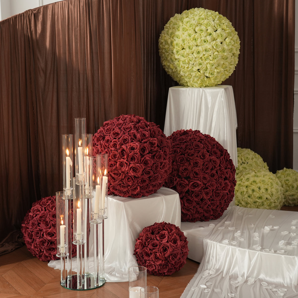 Rose flower ball display against brown drape backdrop