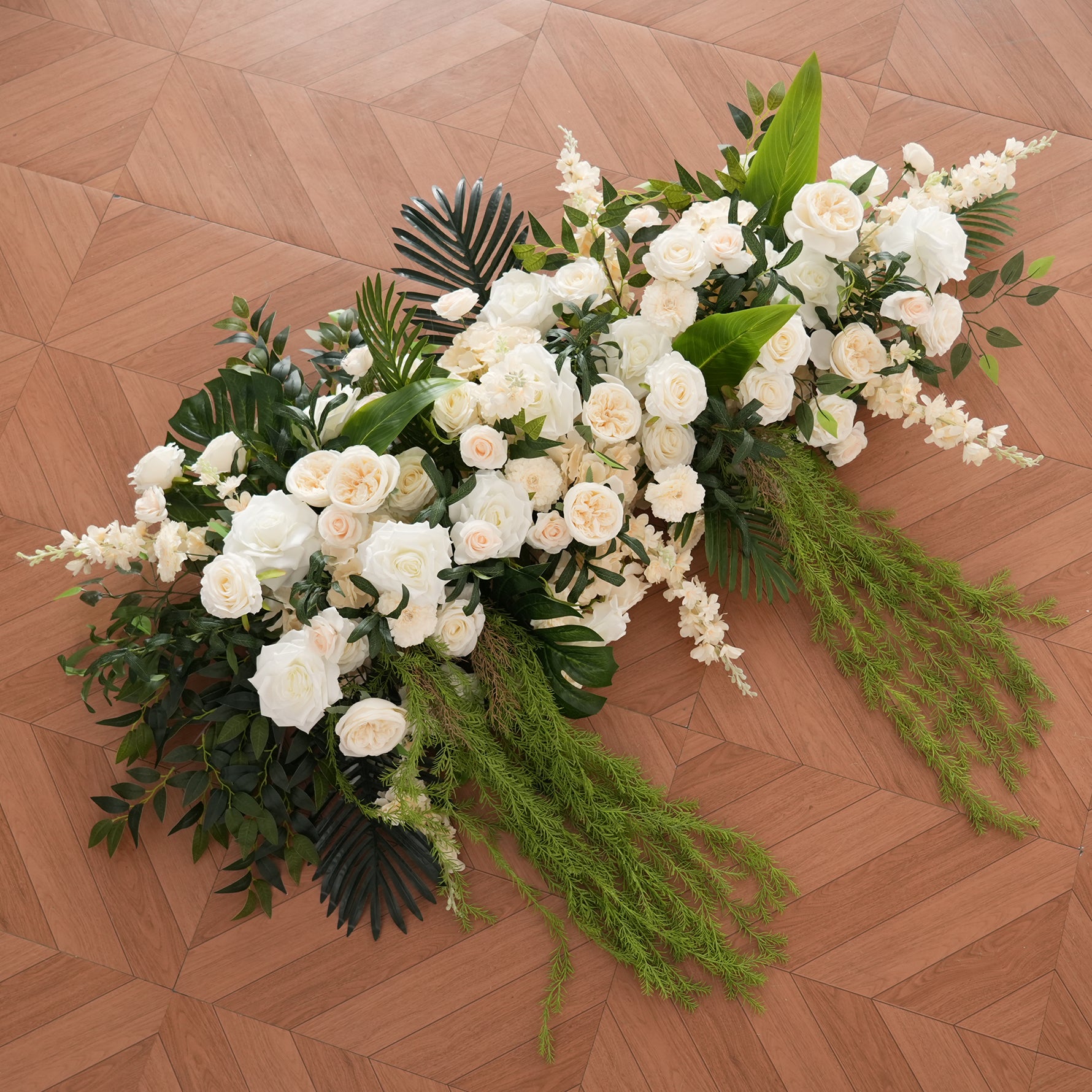 monstera_leaf_wedding_arch_arrangement
