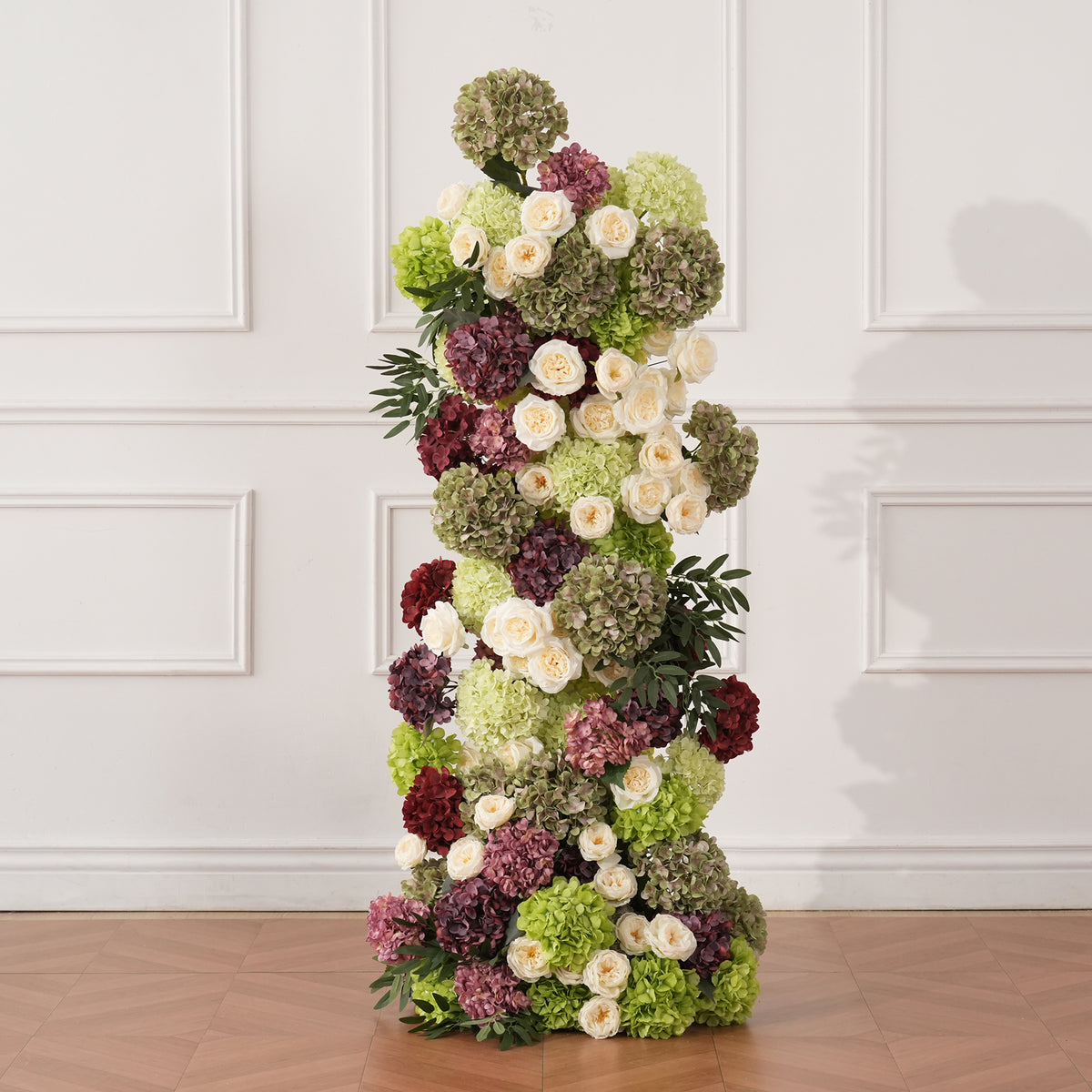 Hydrangea mixed with leafy green foliage for full volume