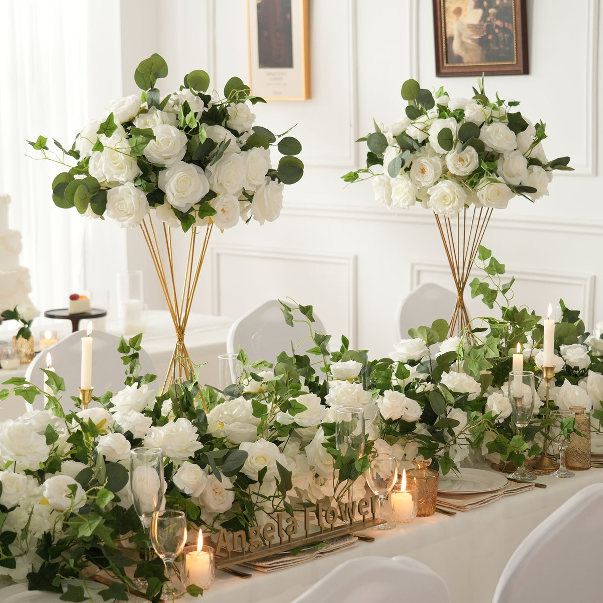 Wedding banquet table styled with matching artificial flower ball and garland