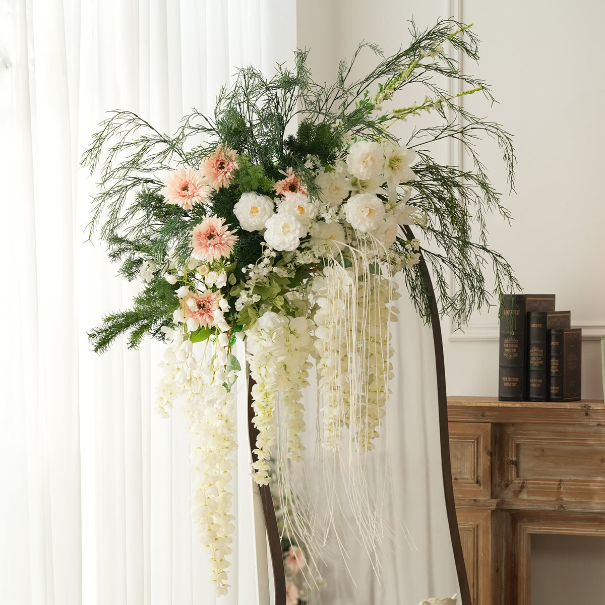 Fine green foliage paired with peach daisy artificial flowers