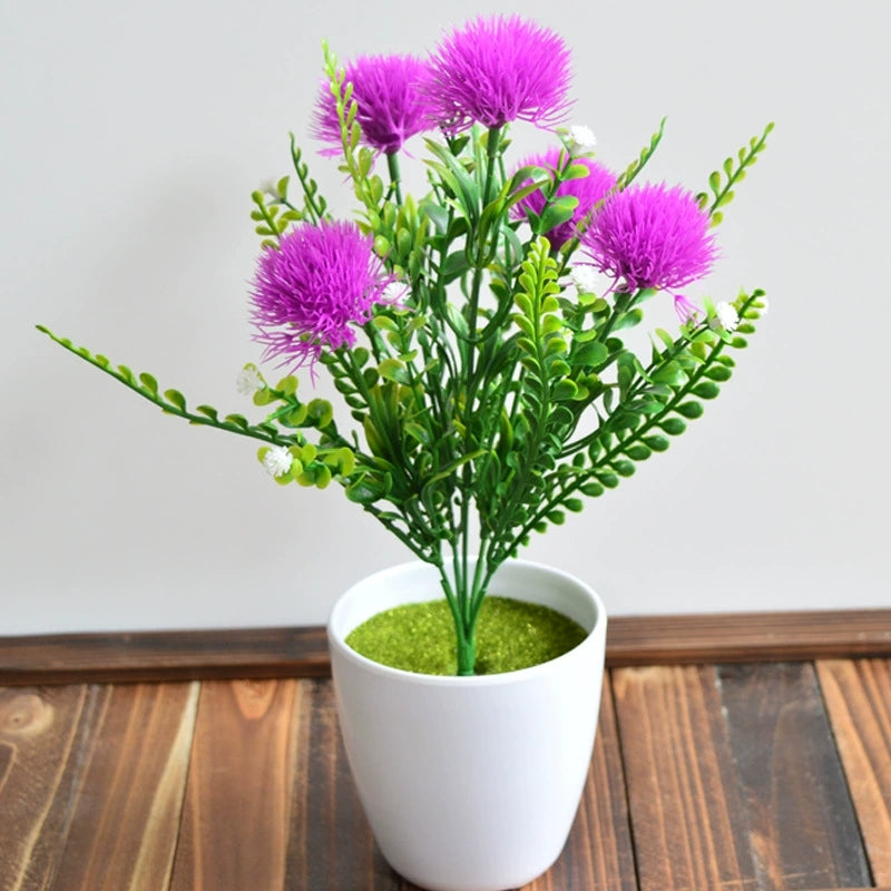 Potted yellow faux flowers with lush green leaves, small tabletop artificial plant decoration