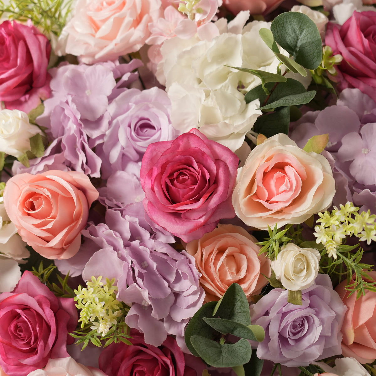 Artificial peach rose table bouquet with eucalyptus greenery for wedding reception
