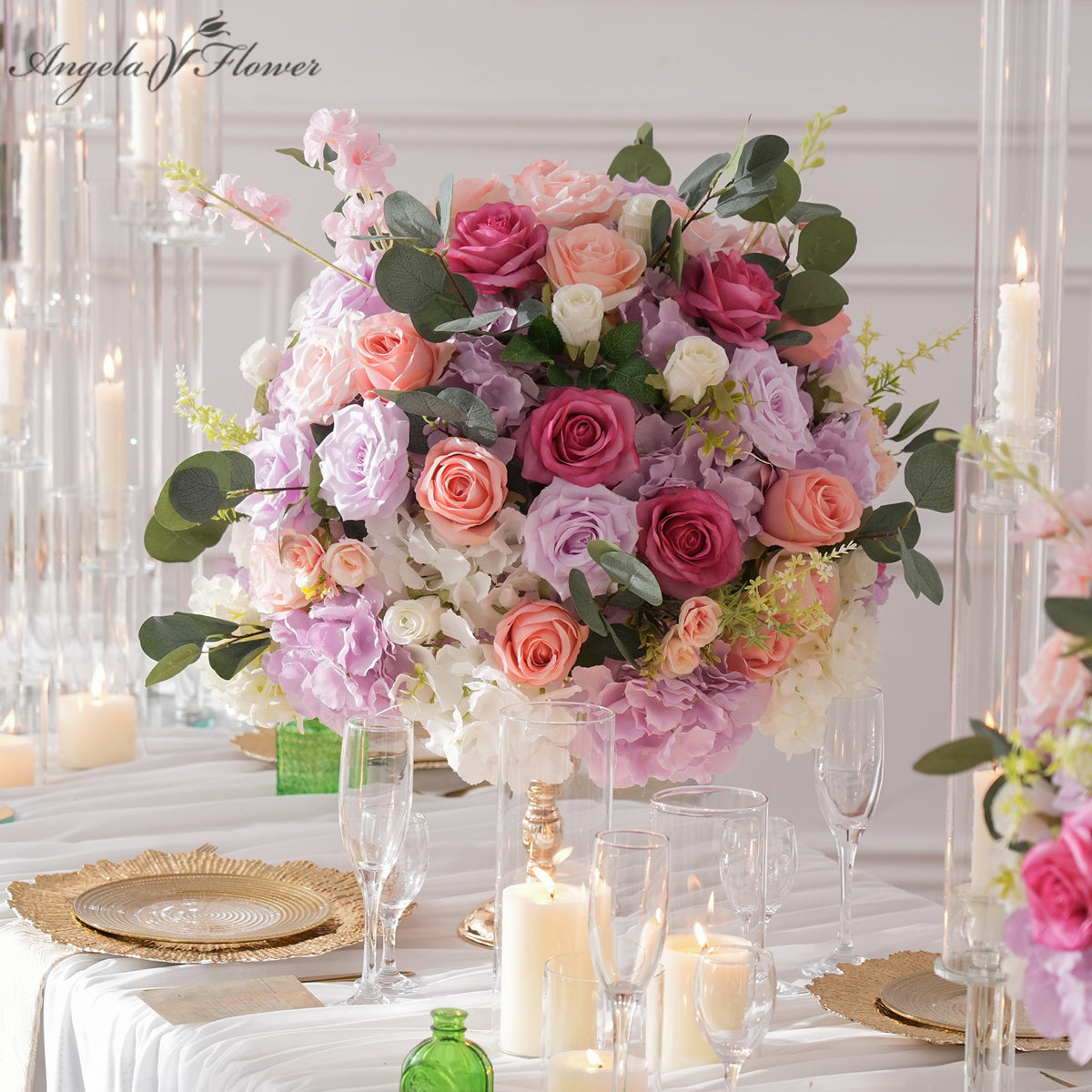 Peach and lilac artificial wedding table centerpiece for lakeside sunset wedding