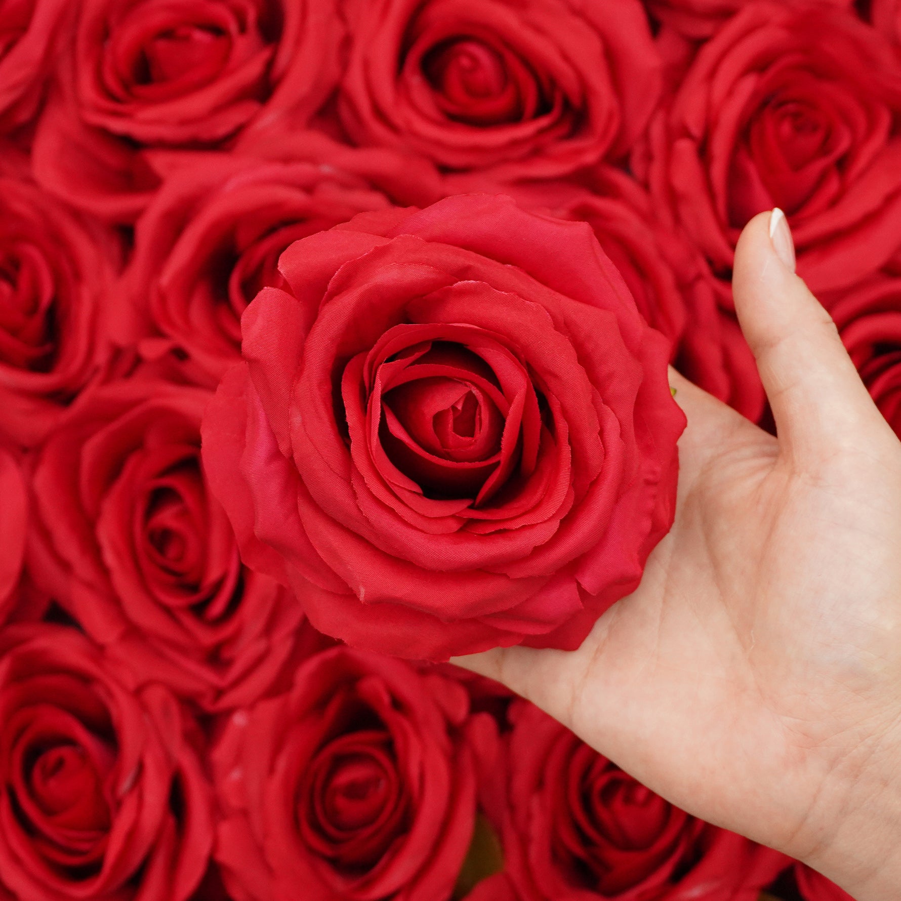 Red silk rose heads for romantic wedding floral arrangements