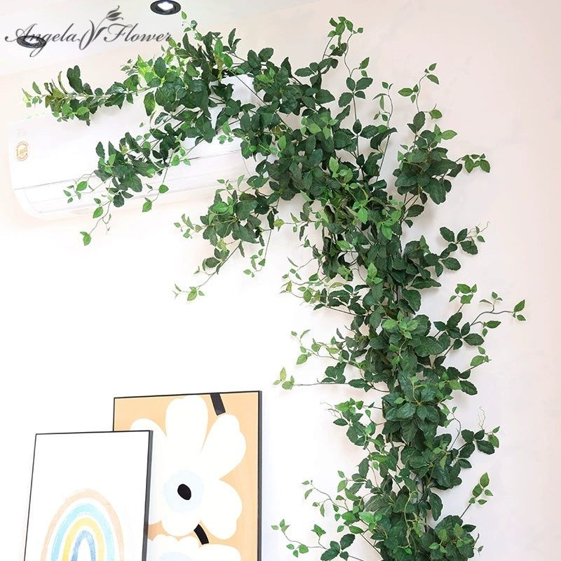 silk green foliage vine to cover air conditioner pipe