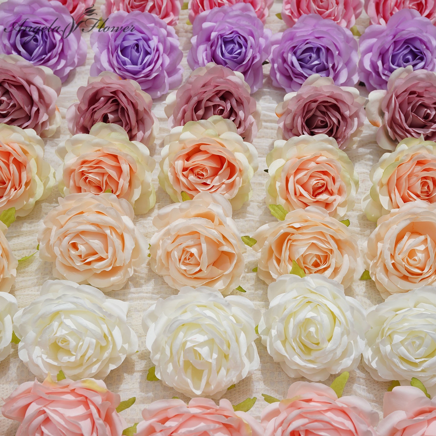 multicolor‑large‑artificial‑rose‑flower‑heads‑flat‑lay‑studio