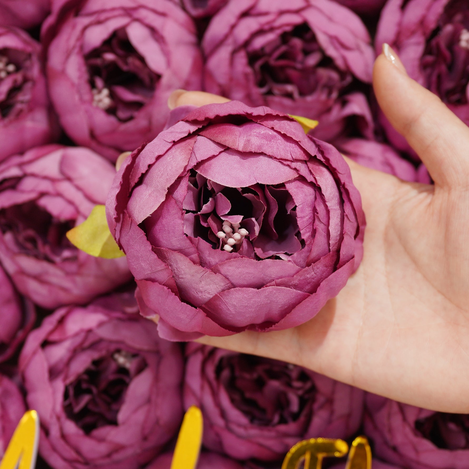 Maroon artificial ranunculus wedding blooms
