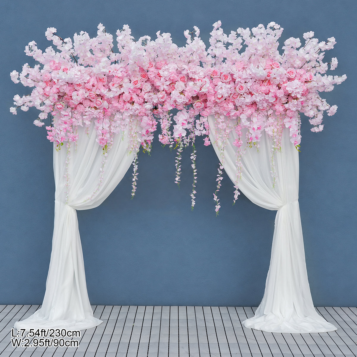 pink wisteria arch display against blue background