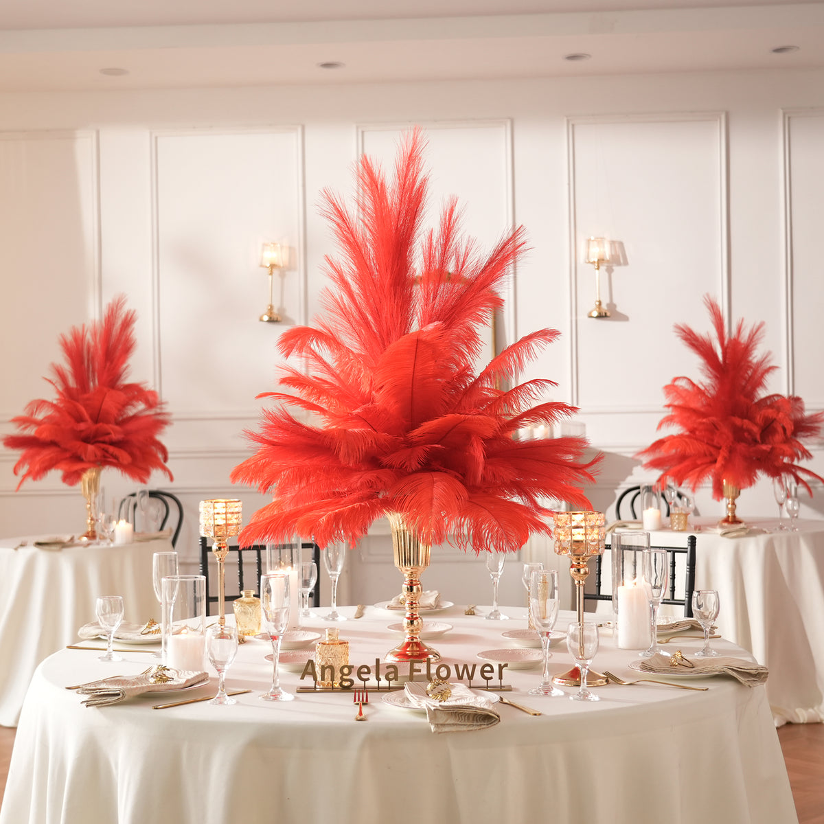 Voluminous feather bouquet held in polished gold decorative vase