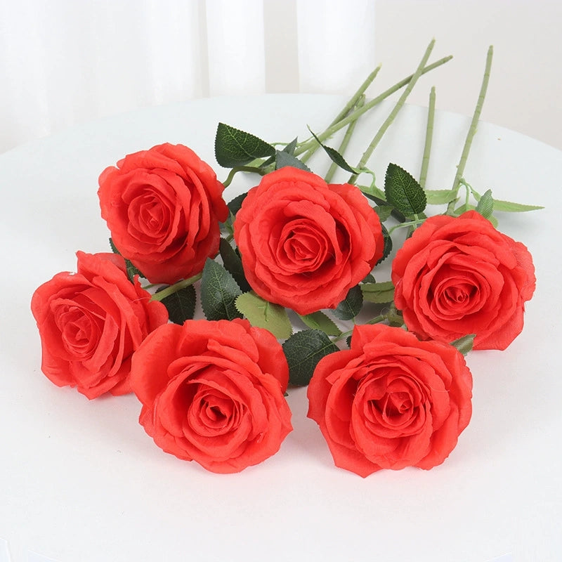 faux‑full‑bloom‑rose‑flowers‑with‑green‑leaves‑studio‑view