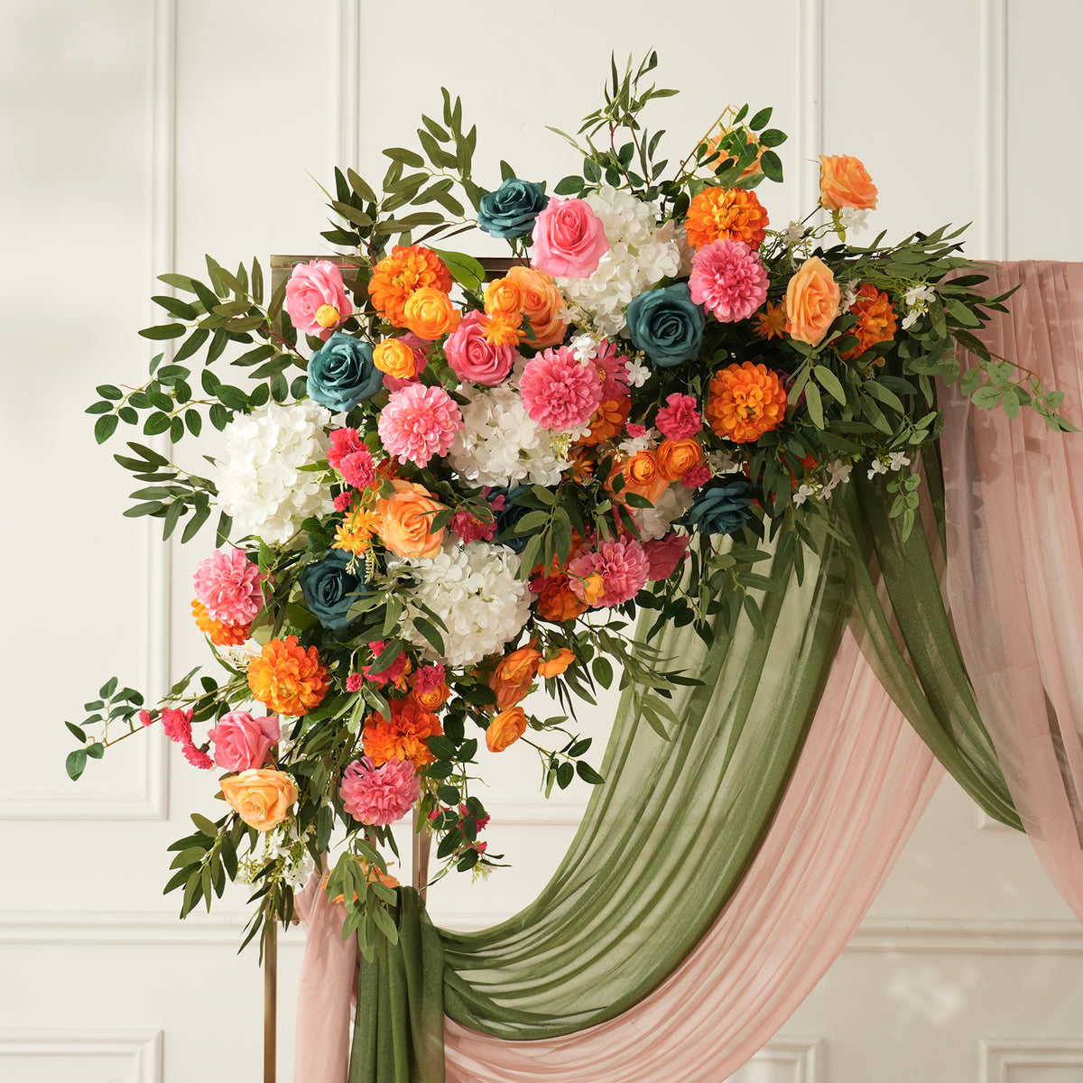 green and blush pink chiffon drape paired with sunset florals