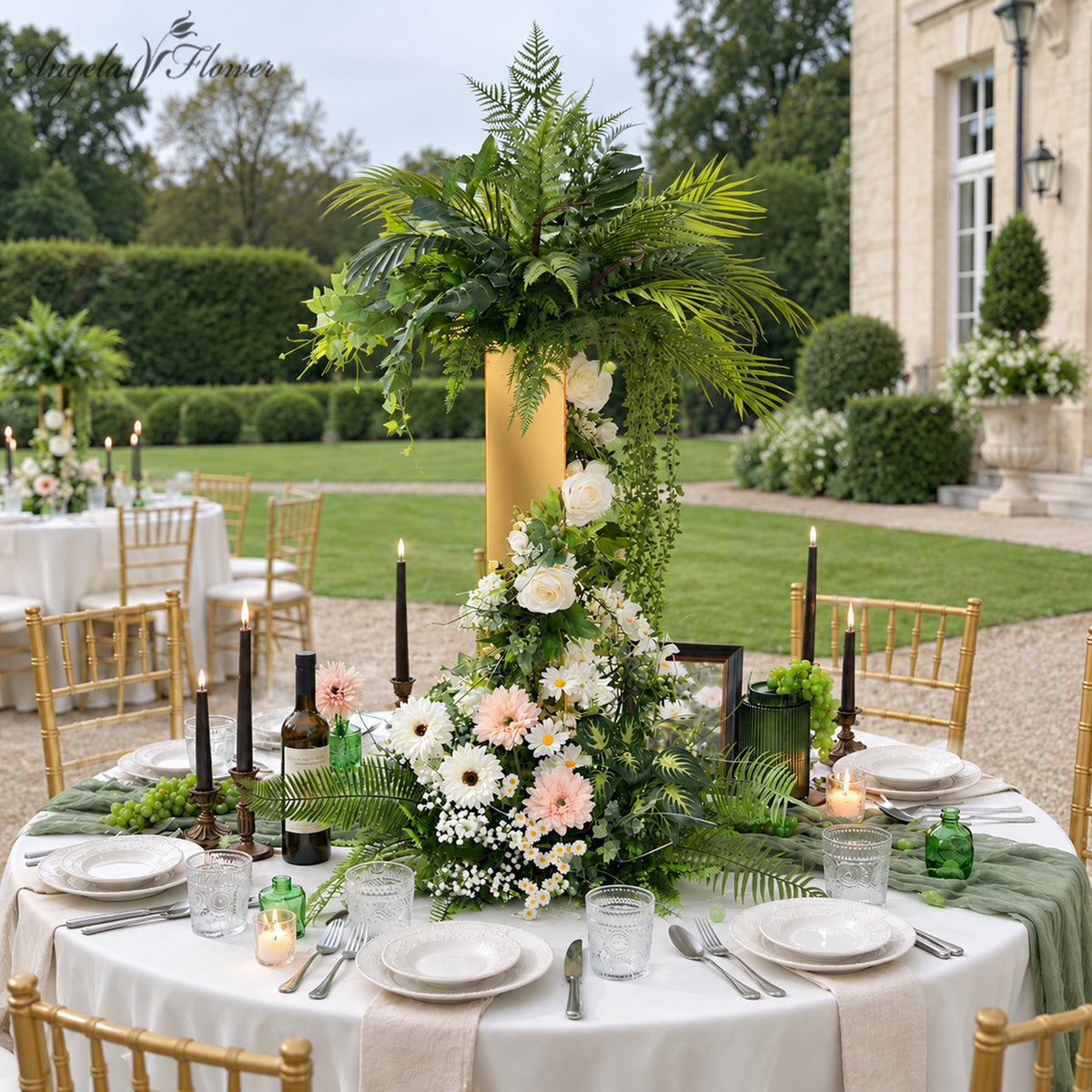 Greenery flower centerpiece styled in outdoor manor scene