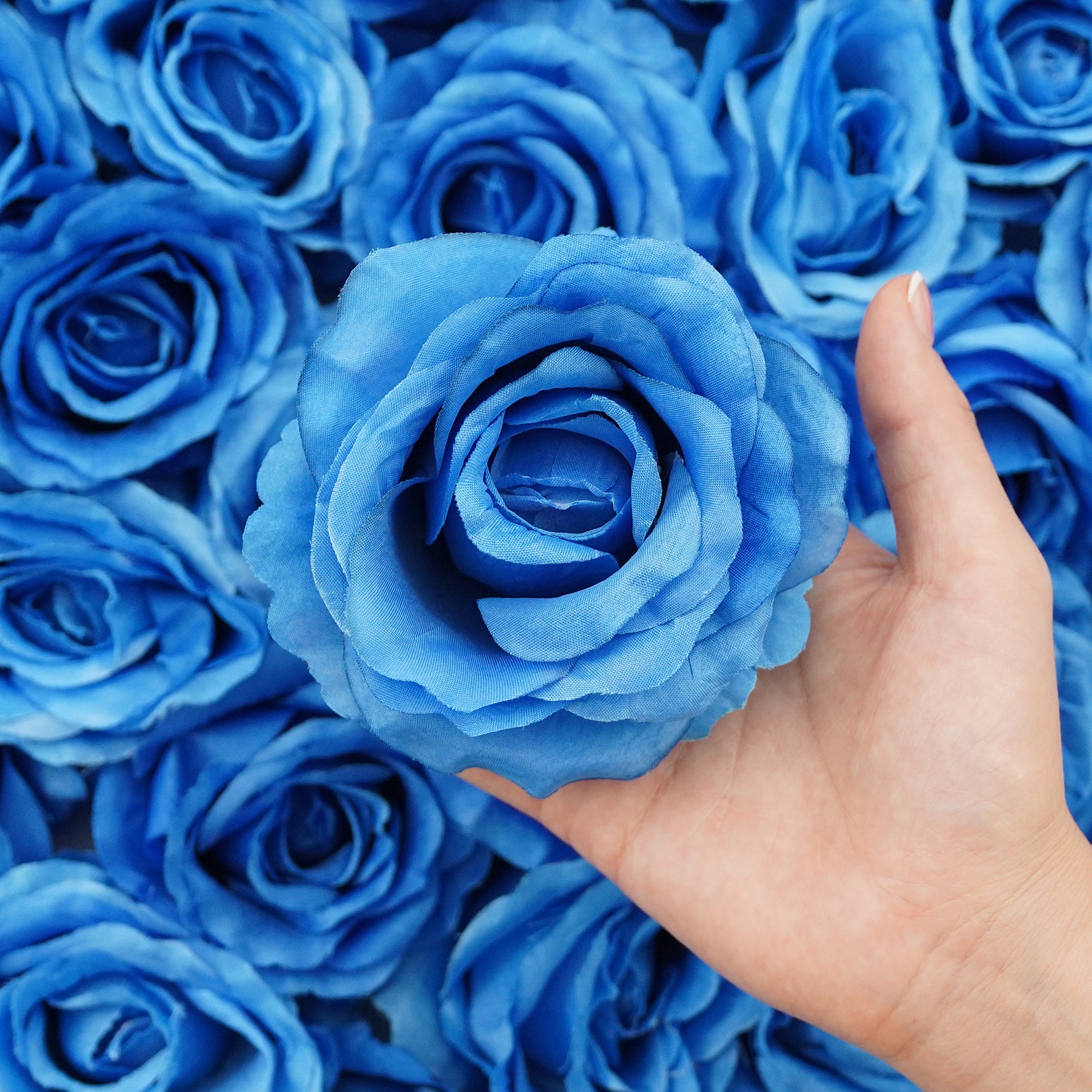 Handmade artificial roses with layered petals for event decor