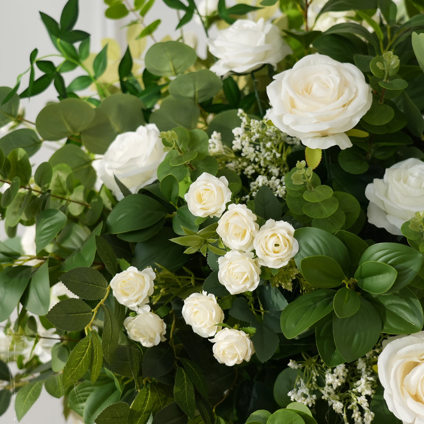 artificial white rose arrangement