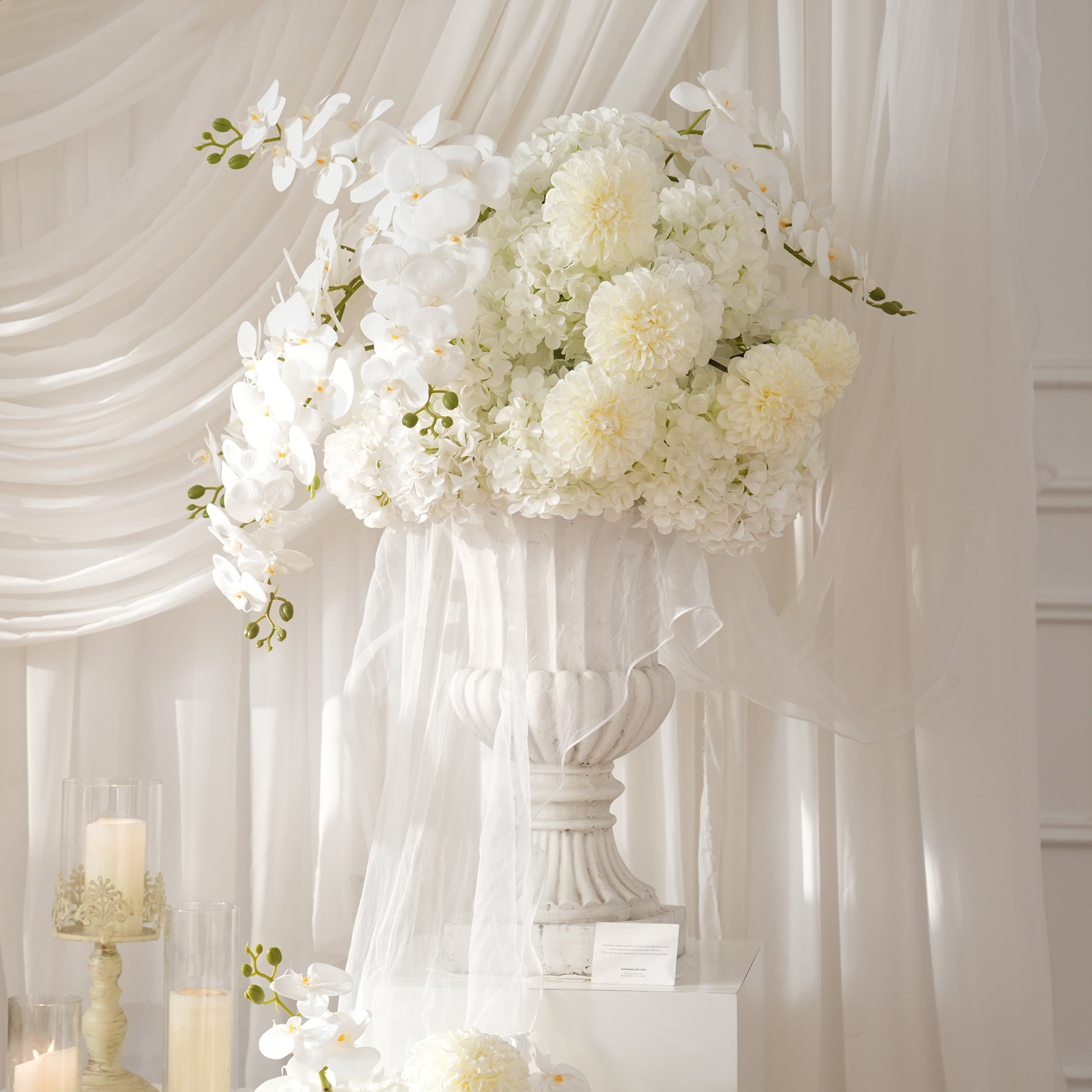 White Hydrangea And Orchid Wedding Centerpiece On Glass Vase