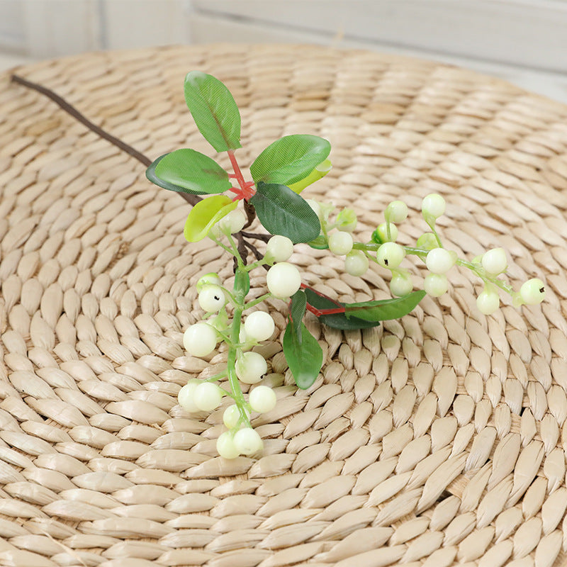 blue_berry_sprig_with_green_leaves