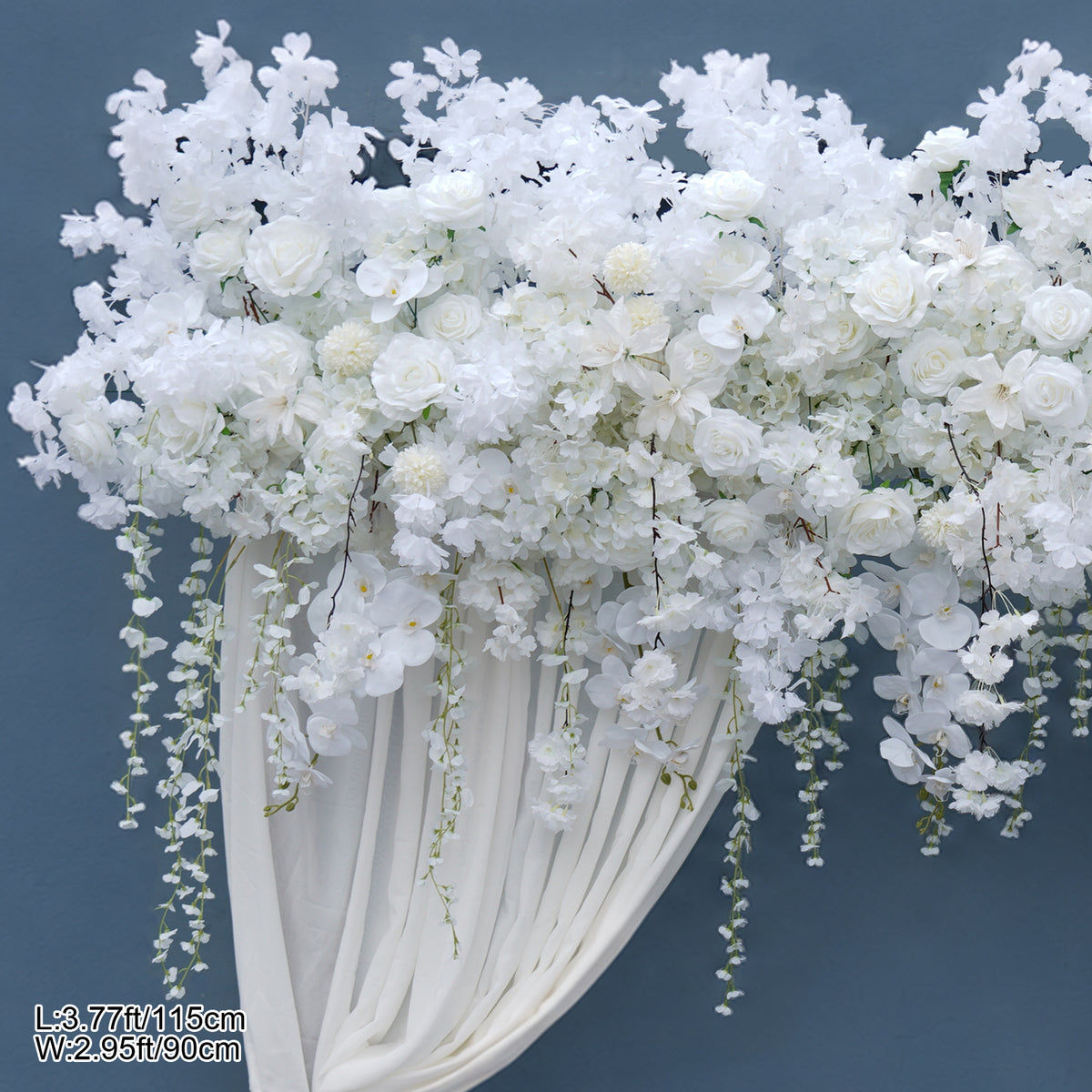 White cascading blossom floral arch with sheer white drape