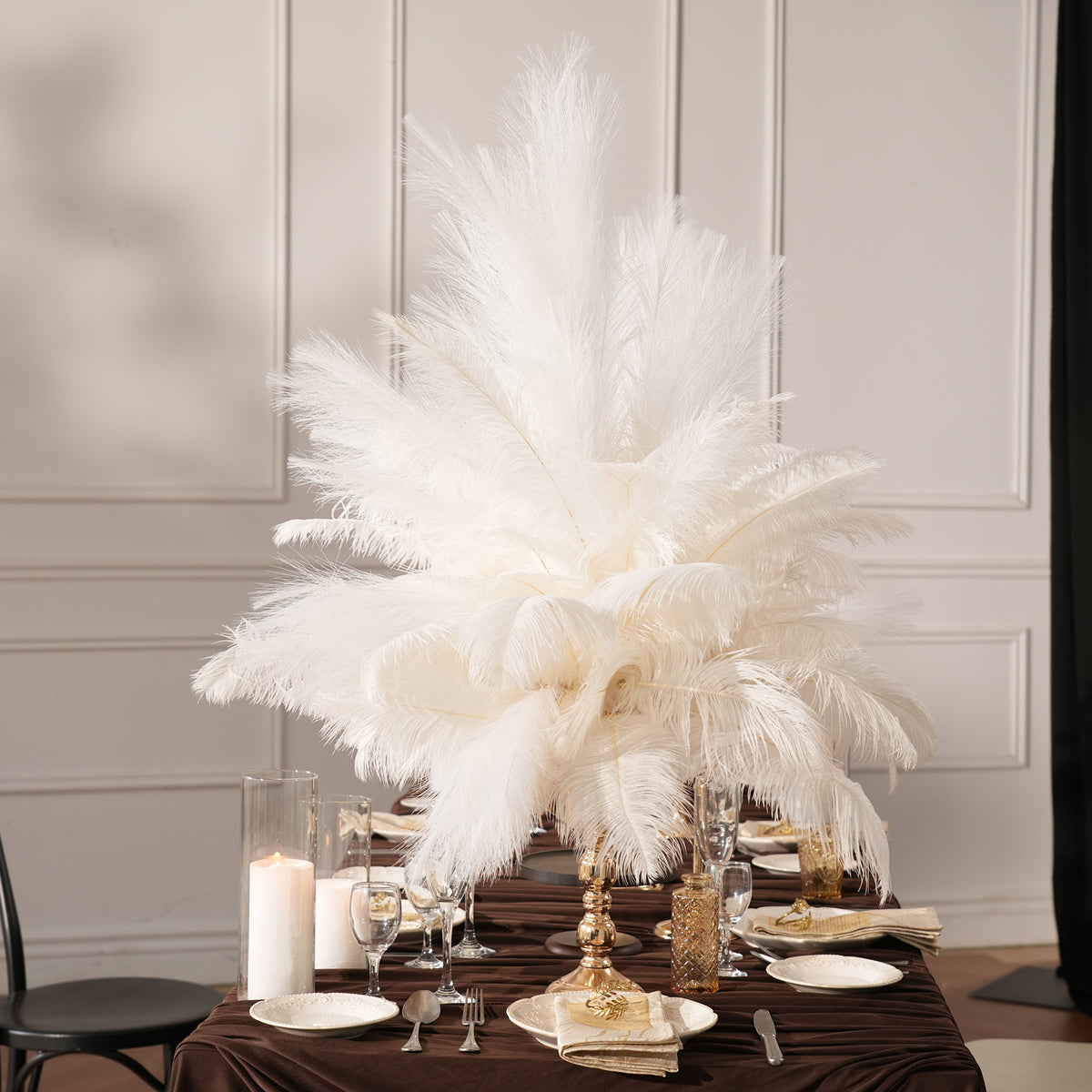 white ostrich feather centerpiece for indoor wedding reception table