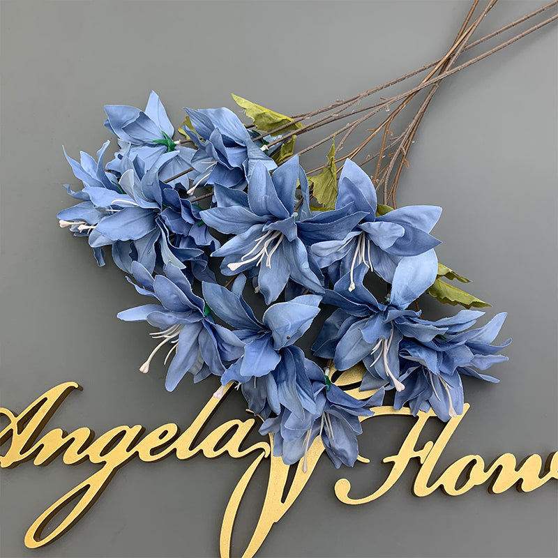 Orange fake lily blooms rustic wedding decor