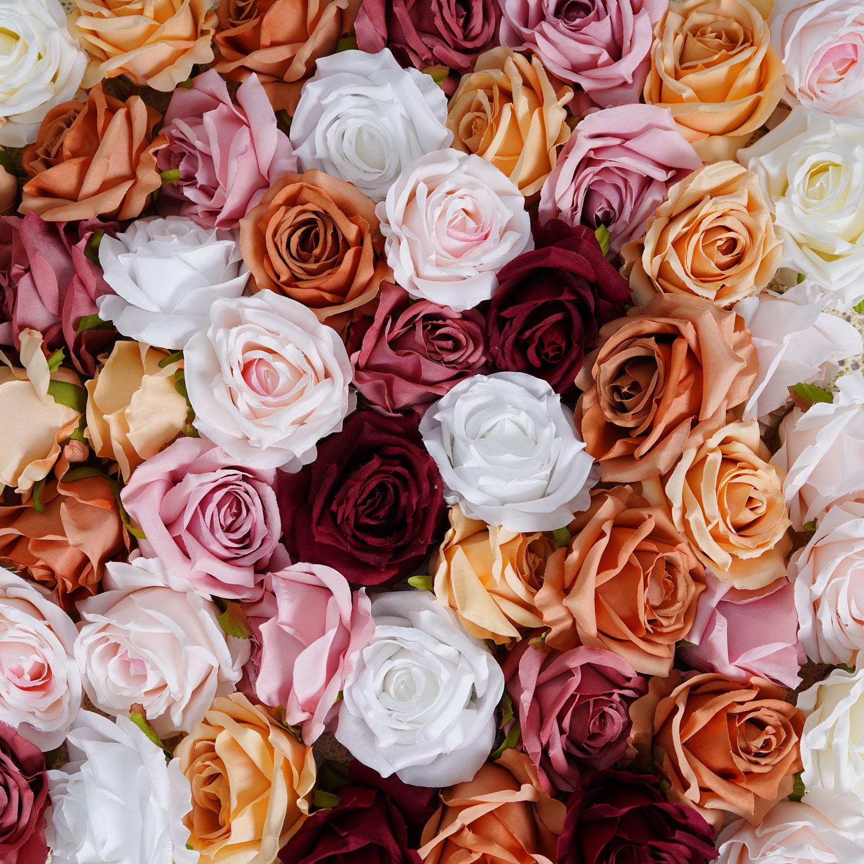 Burgundy faux rose flower head event floral design