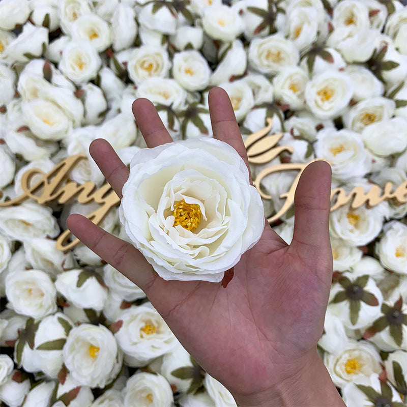 Assorted artificial rose heads flat lay product shot