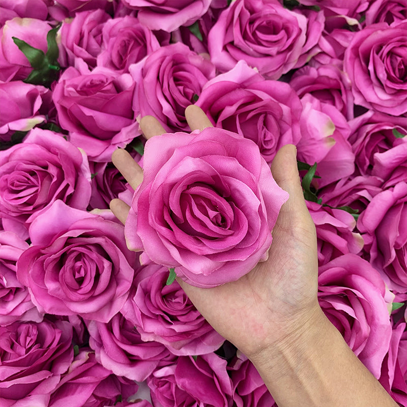 Artificial rose blooms in pink blue yellow and white colors