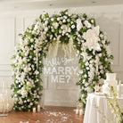 Matching table centerpiece floral for white wedding arch set